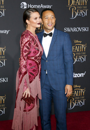 John Legend and Chrissy Teigen at the Los Angeles premiere of 'Beauty And The Beast' held at the El Capitan Theatre in Hollywood, USA on March 2, 2017.のeditorial素材