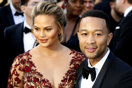 John Legend and Chrissy Teigen at the 88th Annual Academy Awards held at the Hollywood & Highland Center in Hollywood, USA on February 28, 2016.のeditorial素材