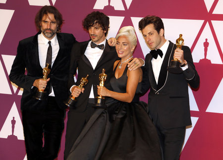 Andrew Wyatt, Anthony Rossomando, Lady Gaga and Mark Ronson at the 91st Annual Academy Awards - Press Room held at the Loews Hotel in Hollywood, USA on February 24, 2019.のeditorial素材