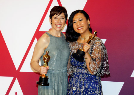 Becky Neiman-Cobb and Domee Shi at the 91st Annual Academy Awards - Press Room held at the Loews Hotel in Hollywood, USA on February 24, 2019.のeditorial素材