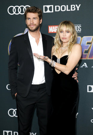 Liam Hemsworth and Miley Cyrus at the World premiere of 'Avengers: Endgame' held at the LA Convention Center in Los Angeles, USA on April 22, 2019.のeditorial素材