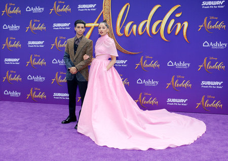 Mena Massoud and Naomi Scott at the Los Angeles premiere of 'Aladdin' held at the El Capitan Theatre in Hollywood, USA on May 21, 2019.のeditorial素材