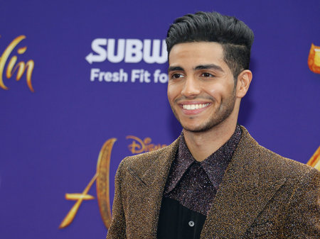 Mena Massoud at the Los Angeles premiere of 'Aladdin' held at the El Capitan Theatre in Hollywood, USA on May 21, 2019.のeditorial素材