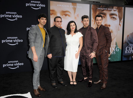 Kevin Jonas, Joe Jonas, Nick Jonas, Paul Kevin Jonas Sr. and Denise Miller-Jonas at the premiere of Amazon Prime Video's 'Chasing Happiness' held at the Regency Bruin Theatre in Westwood, USA on June 3, 2019.のeditorial素材