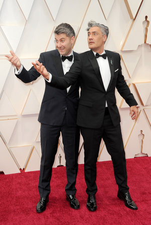Carthew Neal and Taika Waititi at the 92nd Academy Awards held at the Dolby Theatre in Hollywood, USA on February 9, 2020.のeditorial素材