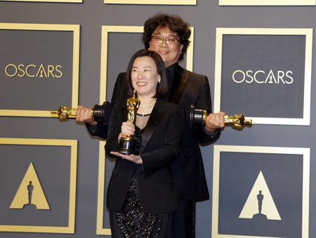 Bong Joon-ho and Kwak Sin-ae at the 92nd Academy Awards - Press Room held at the Dolby Theatre in Hollywood, USA on February 9, 2020.のeditorial素材