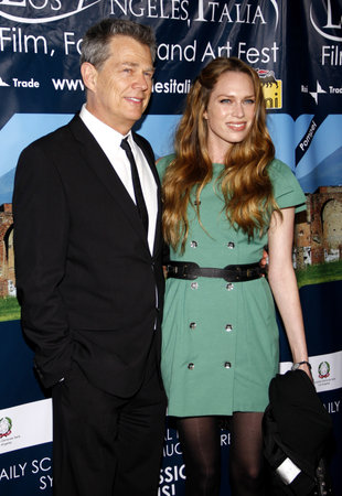 David Foster and Erin Foster at the Los Angeles premiere of 'Andrea Bocelli The Story Behind the Voice' held at the Grauman's Chinese Theater in Hollywood, USA on March 1, 2010.のeditorial素材