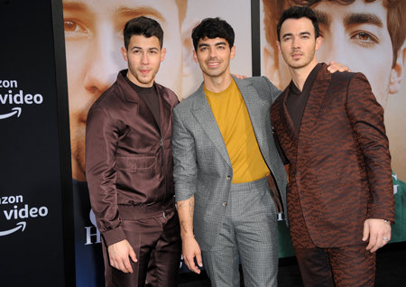 Kevin Jonas, Joe Jonas and Nick Jonas at the premiere of Amazon Prime Video's 'Chasing Happiness' held at the Regency Bruin Theatre in Westwood, USA on June 3, 2019.のeditorial素材