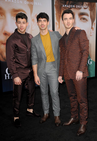 Kevin Jonas, Joe Jonas and Nick Jonas at the premiere of Amazon Prime Video's 'Chasing Happiness' held at the Regency Bruin Theatre in Westwood, USA on June 3, 2019.のeditorial素材