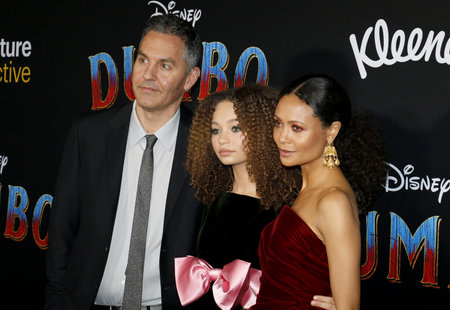 Thandie Newton, Ol Parker and Nico Parker at the World premiere of 'Dumbo' held at the El Capitan Theatre in Hollywood, USA on March 11, 2019.のeditorial素材