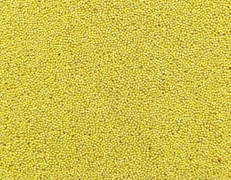 Texture of fine granular oatmeal in yellow.の写真素材
