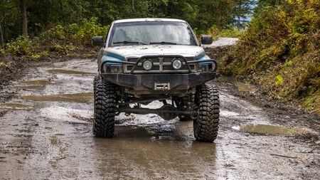 British Columbia, Canada. Off-road monster truck in the forest.