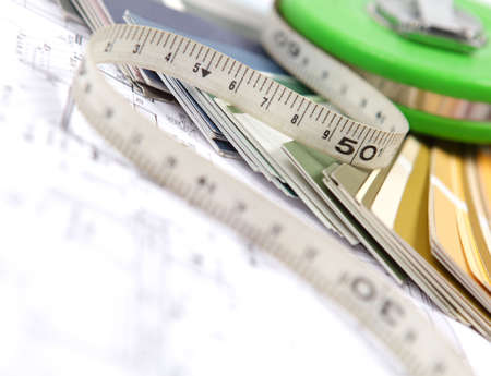 tools and accessories for home renovation on an architectural drawingの写真素材
