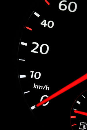 automobile speedometer on black background