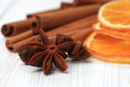 Sliced dried orange with cinnamon sticks and anise