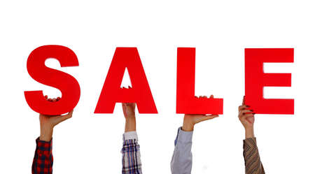 Sale topic: Many Hands holding a cards with the word Sale isolated on white background in studioの写真素材