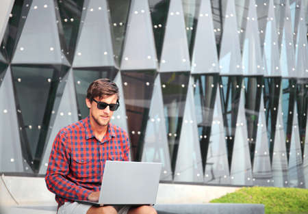 man with laptop outdoor