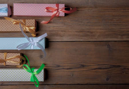 top view of colored gift boxes on old wooden backgroundの写真素材