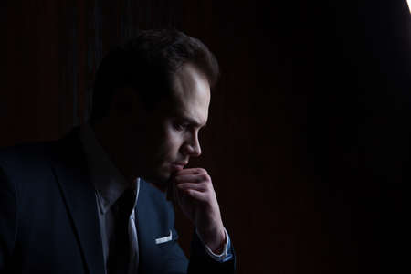 Portrait of a businessman on black backgroundの写真素材
