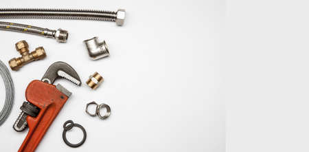 plumbing tools and equipment on white background with copy space
