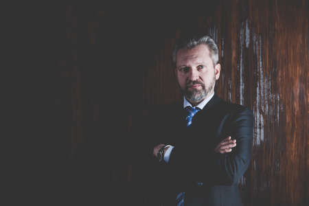 Portrait of a mature businessman on black backgroundの写真素材