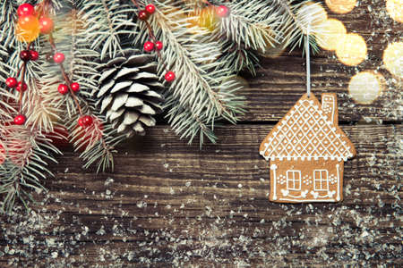 Christmas fir tree with decoration on dark wooden backgroundの写真素材