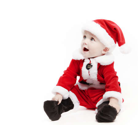 Santa Claus baby in red christmas clothes isolated on whiteの写真素材