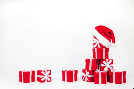 Christmas red and white gift boxes stay in line with copy space. Isolated on whiteの写真素材
