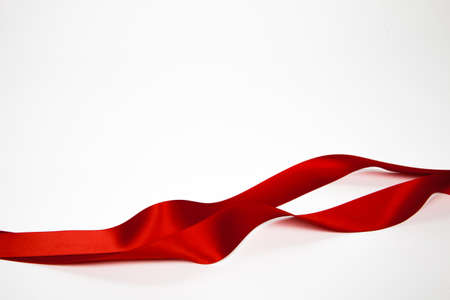 Red ribbon on a white background. Isolatedの写真素材