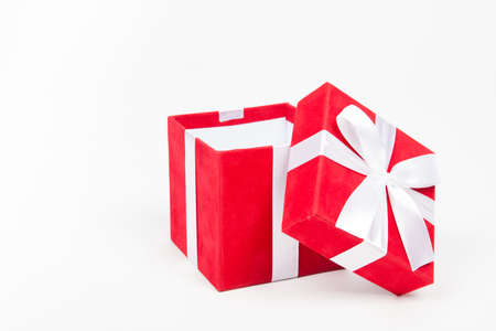 Red gift box isolated on white background. Christmas or birthday conceptの写真素材
