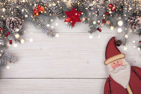 Christmas background on the white wooden desk with Santa Claus. Top viev with copy spaceの写真素材