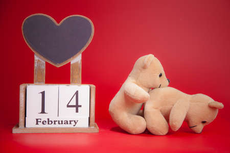 Couple Teddy Bears on red background. Valentines Day card. Love heart.の写真素材