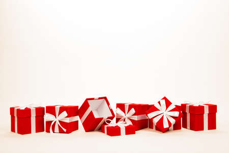 Christmas red gift boxes stay in line with copy space. Isolated on white