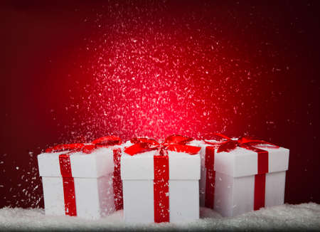 White gift boxes on red background. Copy spaseの写真素材
