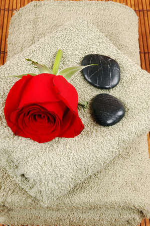 Towels, rose, and pebblesの写真素材