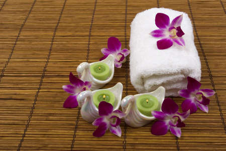 Towel, orchids, candles, and swansの写真素材