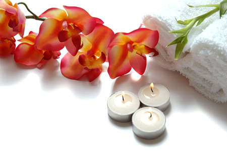  A beautiful orchid, towels, aromatic candles and bamboo plant             の写真素材