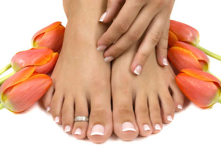 Elegant tulips manicured hand and pedicured feetの写真素材