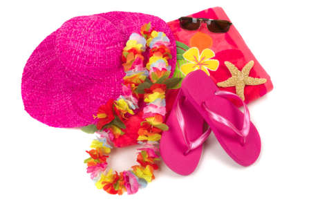 Colorful summer beachwear, flipflops, hat, orchids, sunglasses, and starfishの写真素材