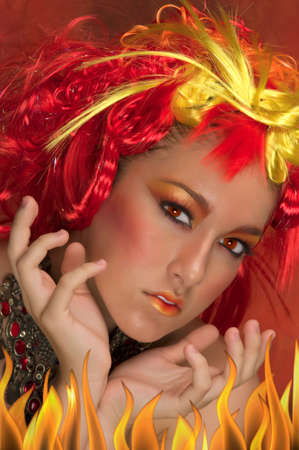 Girl with red, orange, yellow hair and beautiful make up の写真素材