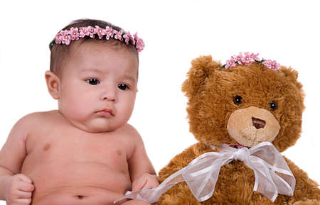 3 month old baby girl her toy bearの写真素材