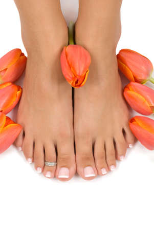 Elegant tulips and pedicured feetの写真素材