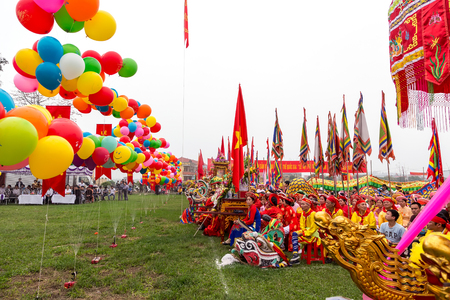 NAMDINH - VIETNAM, APRIL 6, 2014  Dragon dance performers during the Phu Day festival held in Nam Dinh, Vietnam のeditorial素材