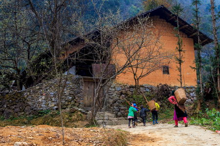 HA GIANG, VIETNAM - FEB 16  Unidentified kids Ethnic Minority go home with mom on February 16, 2014 in Ha Giang , Vietnam  のeditorial素材