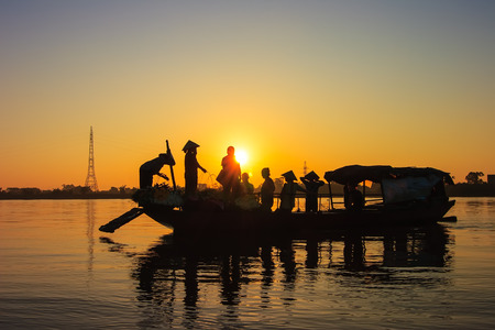 Fishermen in Red river sunset  Fishermen is finish a day of fishing in Red river lake in Ha Noi, Vietnam  の写真素材