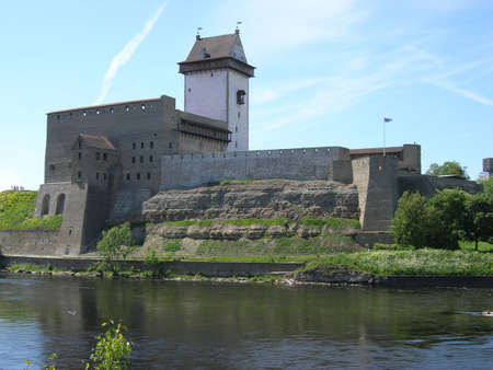 The estonian fortress Narva with the Tall Herman tower and the boundary river Narvaの写真素材
