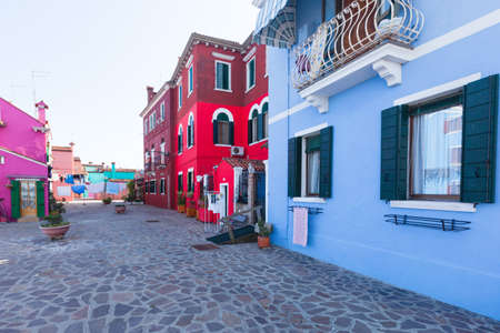 Colourfully painted houses on Burano. Burano is an island in the Venetian Lagoon, northern Italy. It is situated at the northern end of the Lagoon, and is known for brightly coloured homes.の写真素材