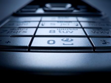 The keyboard of a modern mobile phone close up (macroshooting).の写真素材