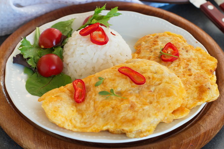 Turkey schnitzel with riceの写真素材