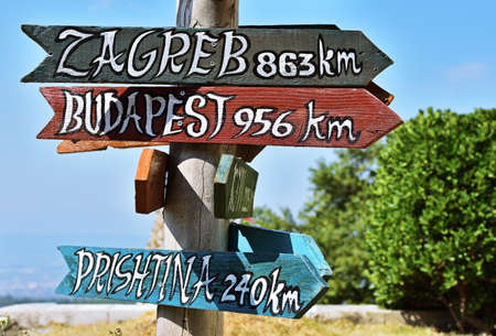 Signs in Kruje showing distance to different cities